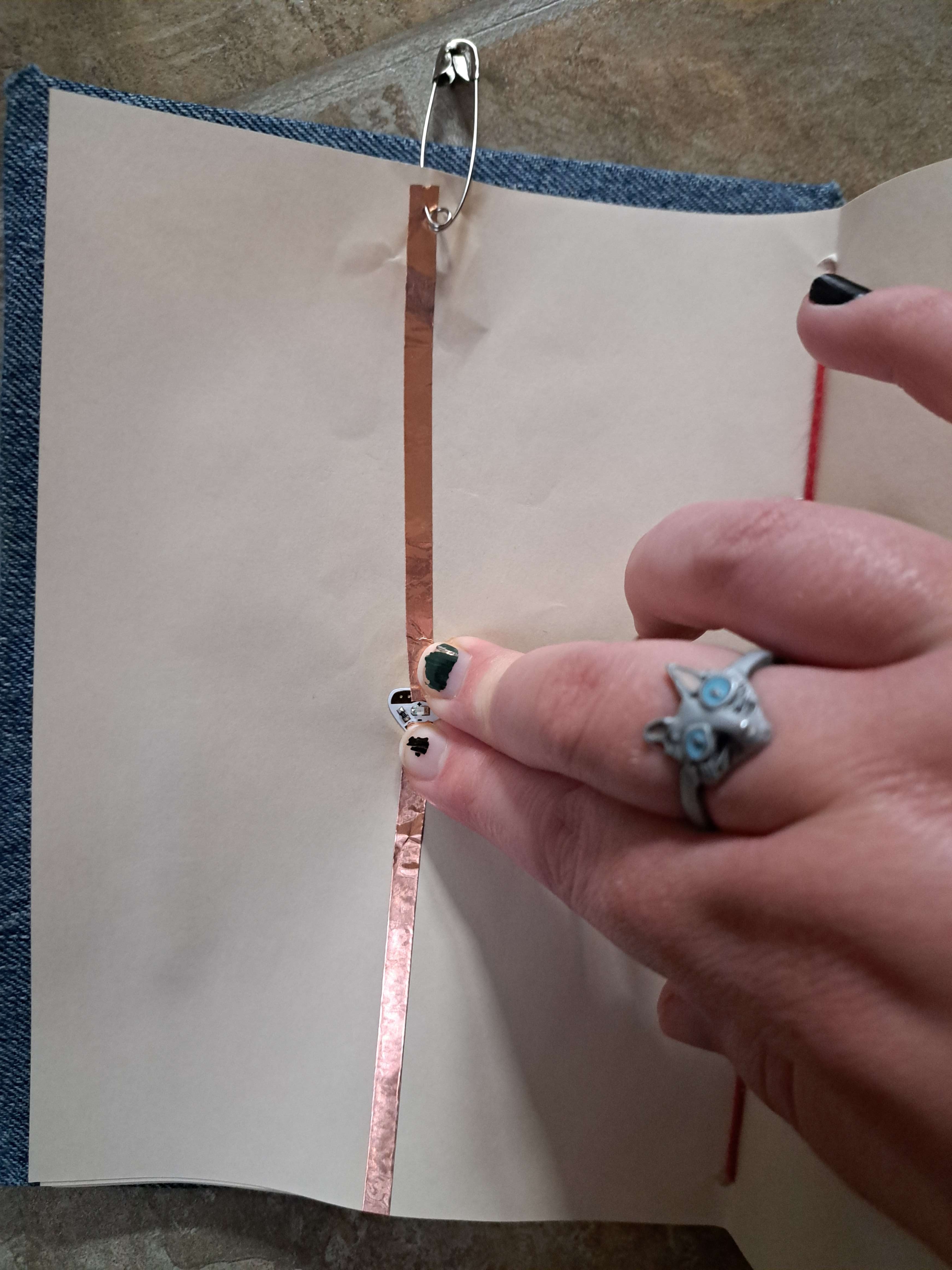 trying a safety pin since I knew it worked earlier<br>was not strong enough to get proof of it working