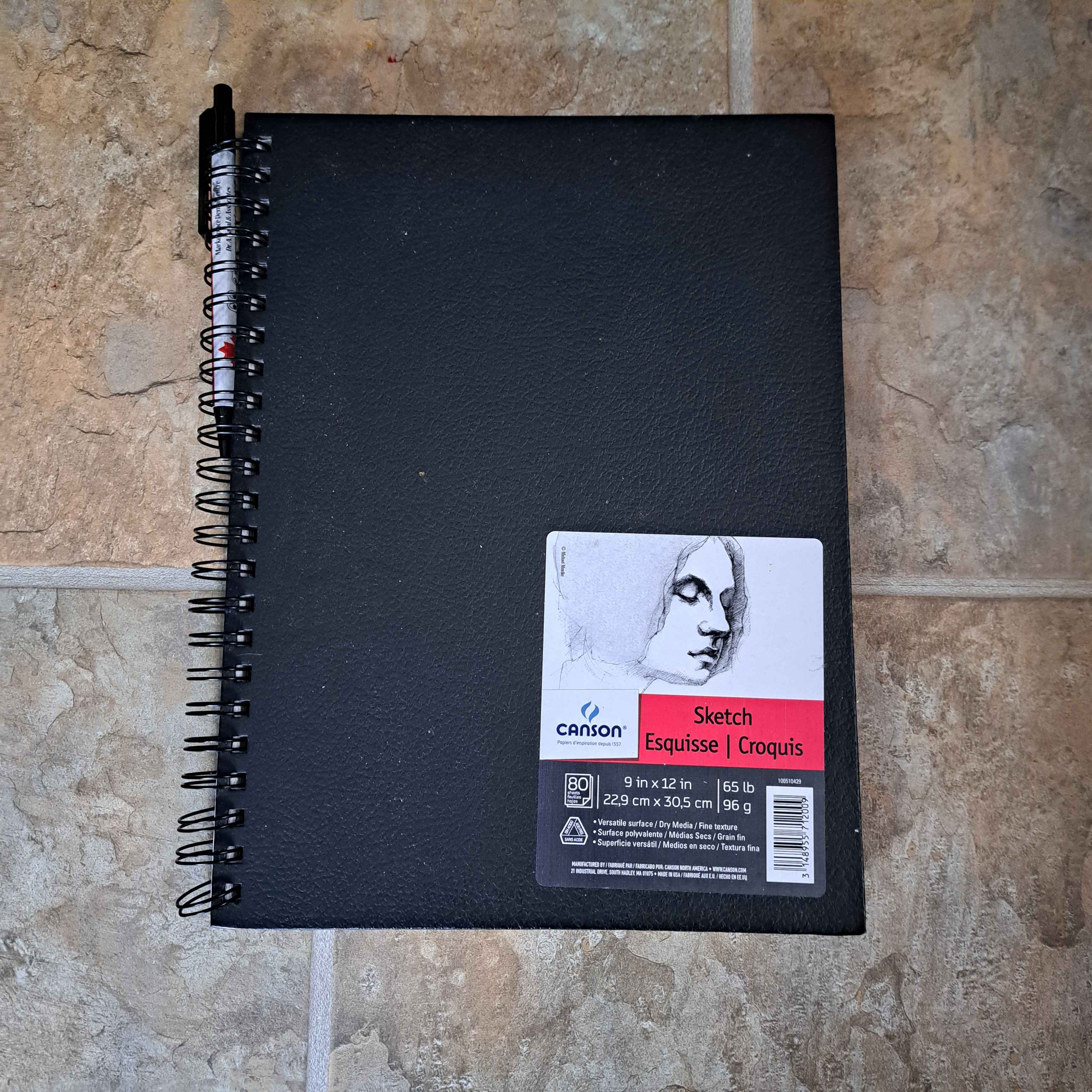 the metal ring binding on a book<br><audio controls src='audio/book.mp3'></audio>